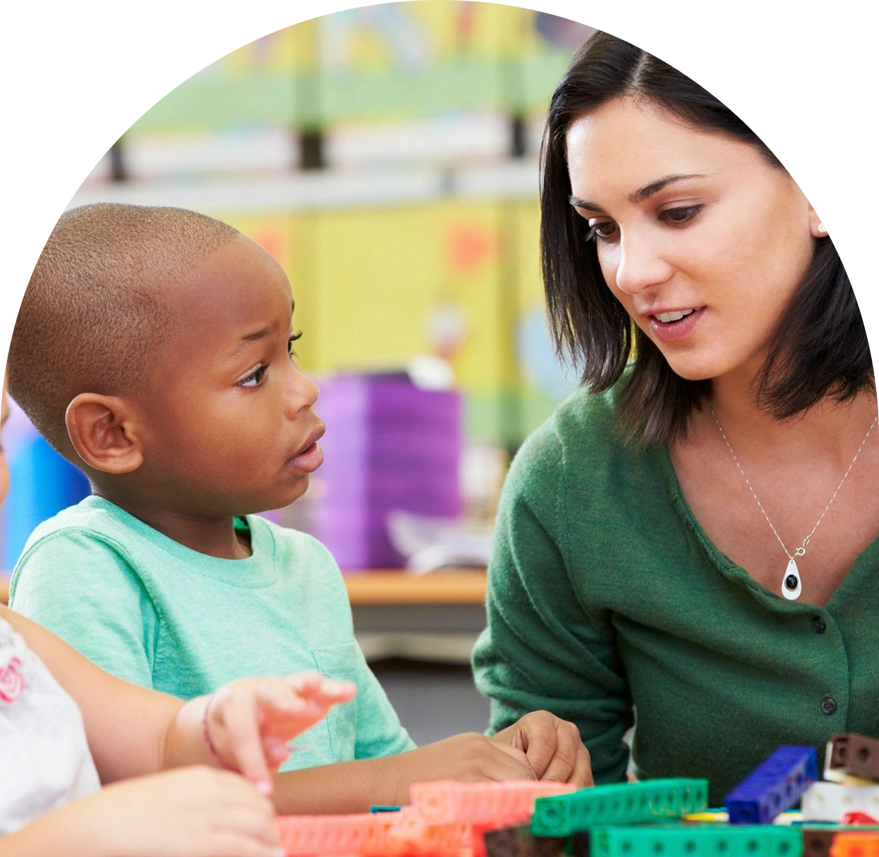 h1-2 A woman and child playing with blocks in a room.
