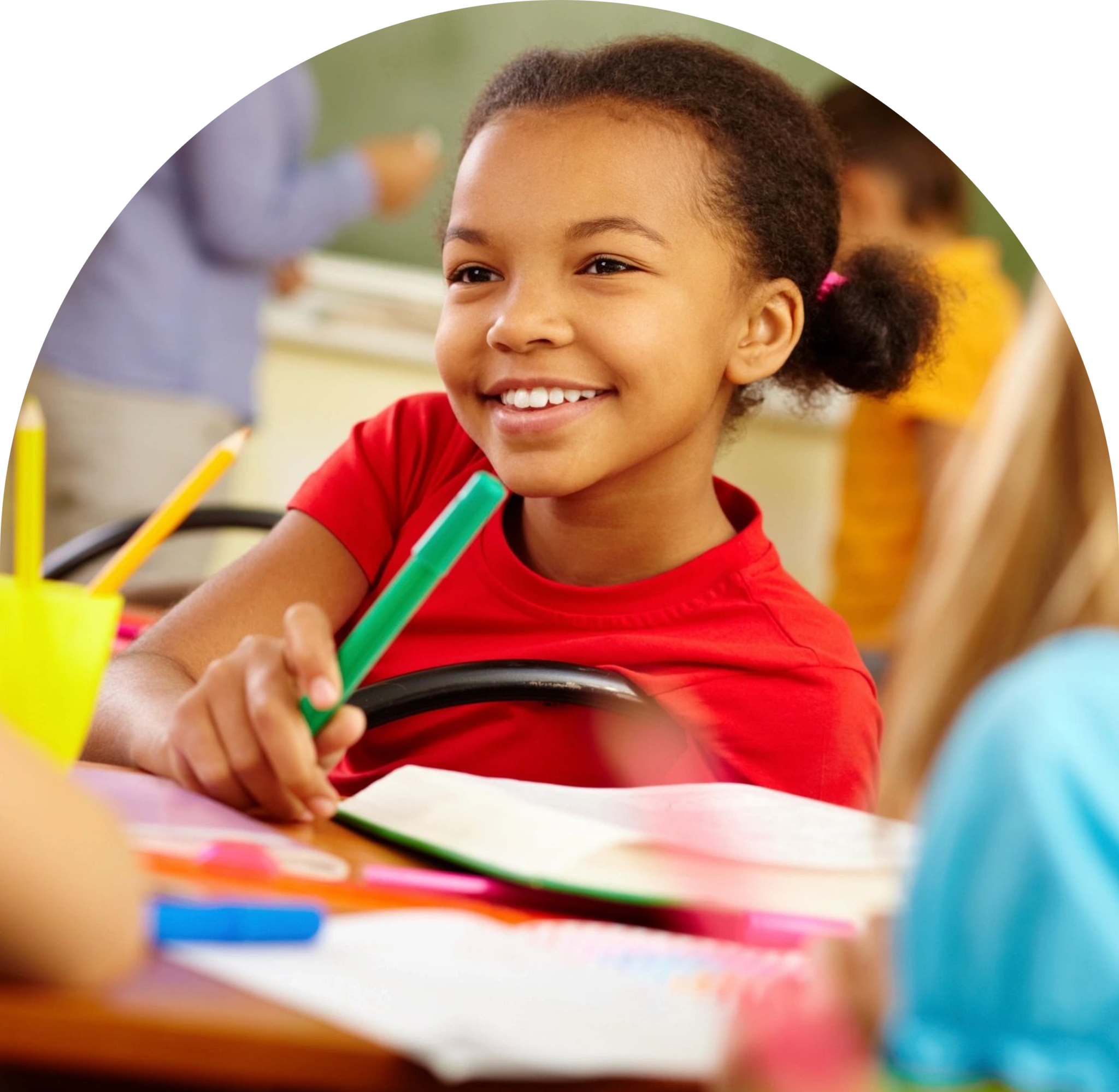 GettyImages-2192762322-8-2048x1999 A young boy smiles while holding a pair of green pencils.