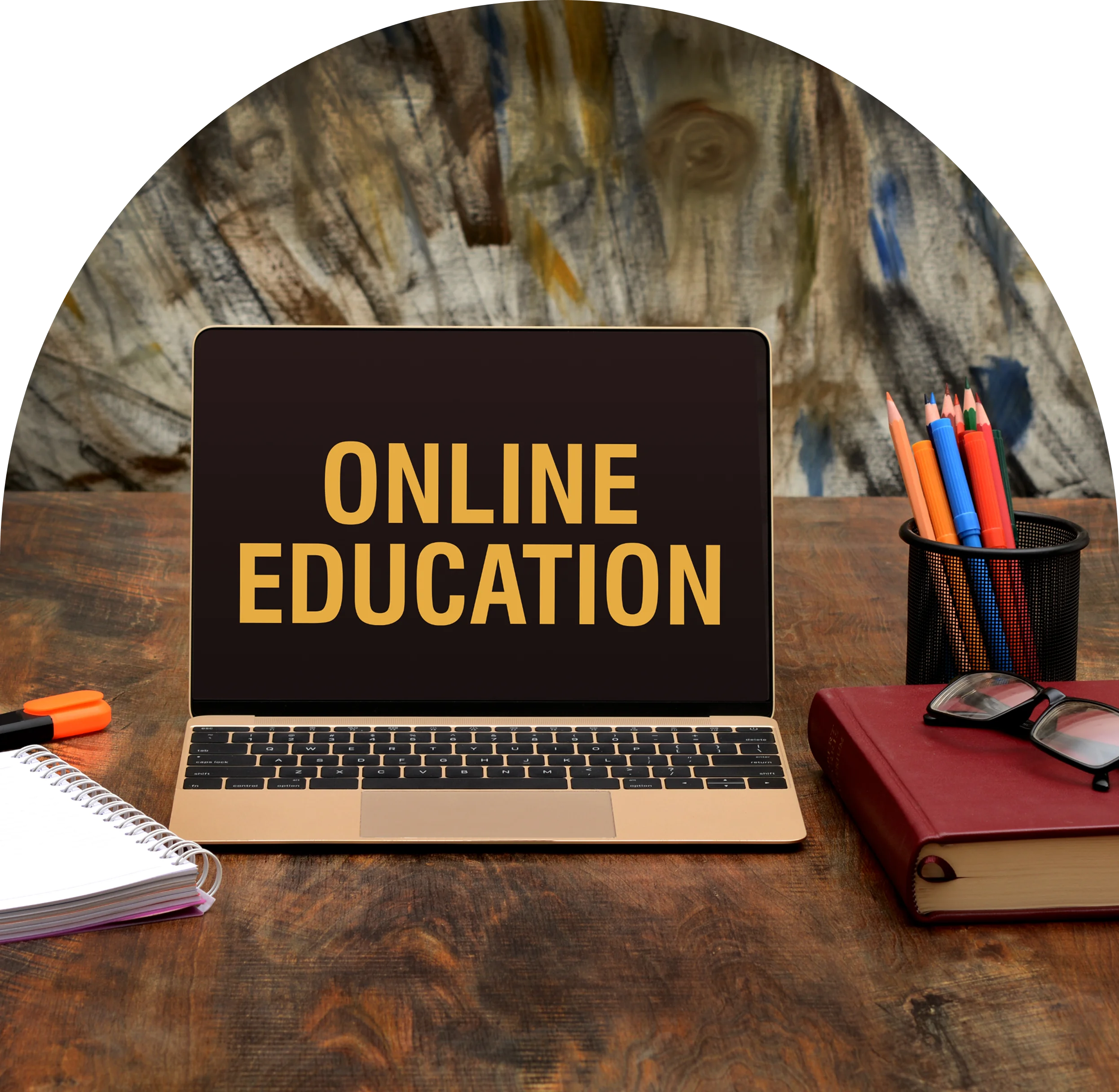 GettyImages-2192762322 (12) Laptop displaying "Online Education" on wooden desk.