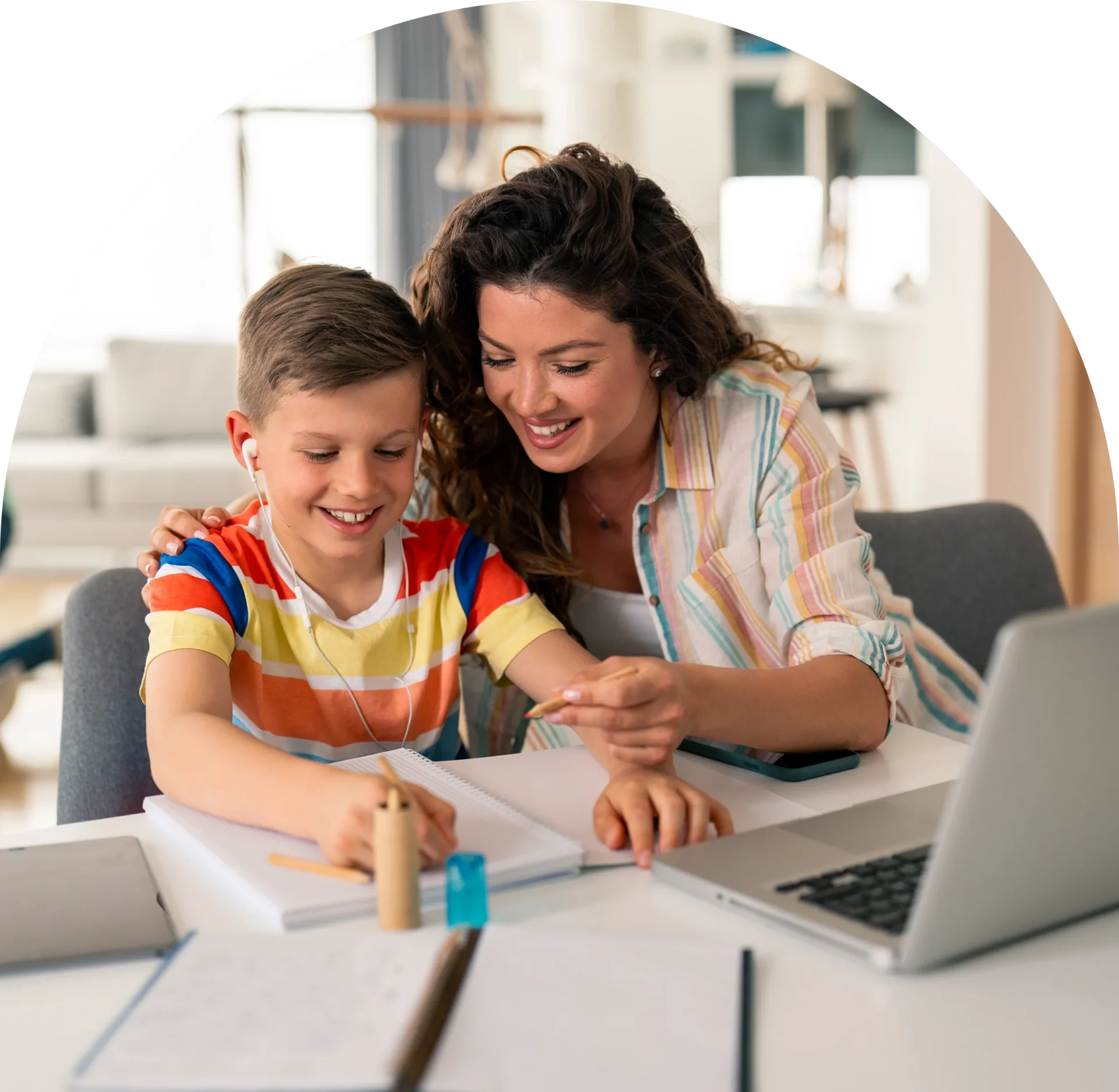 GettyImages-2192762322 Mother and son learning together at home.